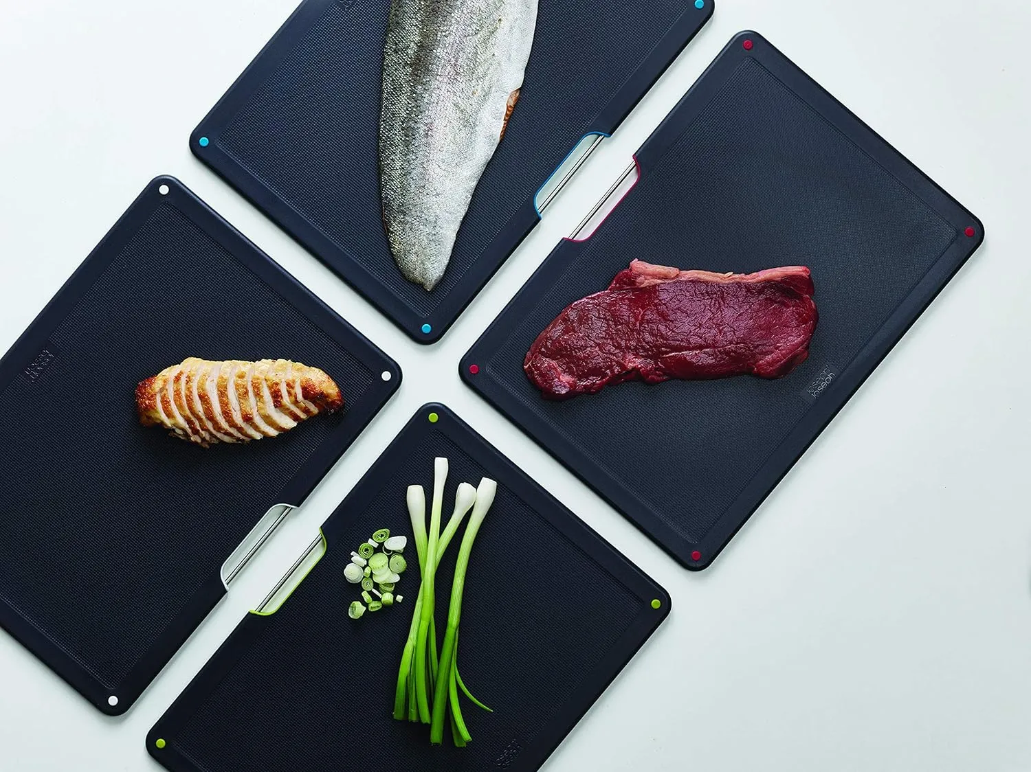 Joseph Joseph Folio 4-Piece Colour coded Cutting Board Set, Stainless Steel Slimline case for organized Kitchen storage, Black